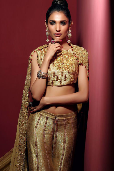 Gold choli with gharara and grand veil